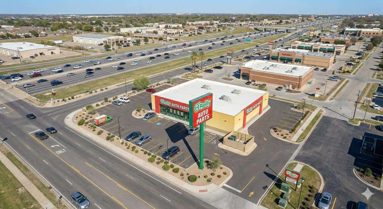 O'Reilly Auto Parts NNN investment property in Dallas-Fort Worth Texas showing freestanding store on high-traffic I-35 corridor with suburban growth market visibility