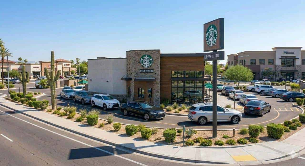 Starbucks NNN investment property in North Scottsdale Arizona showing freestanding drive-thru coffeehouse in affluent 125K plus median income market with desert landscaping and premium retail surroundings